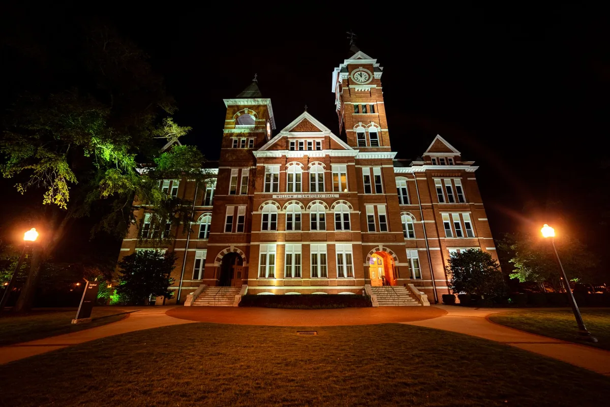Samford Hall clock tower at Auburn University lit up at night