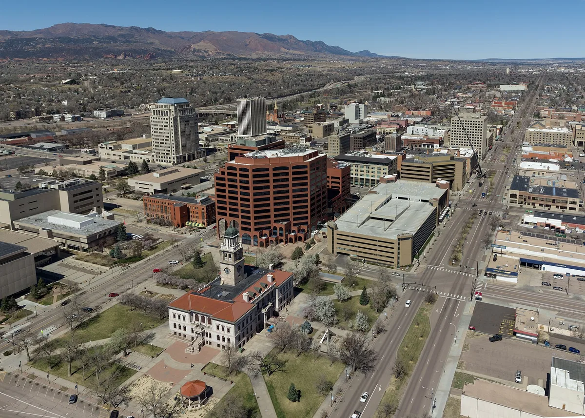 Skyline of downtown Colorado Springs with the Rocky Mountains behind
