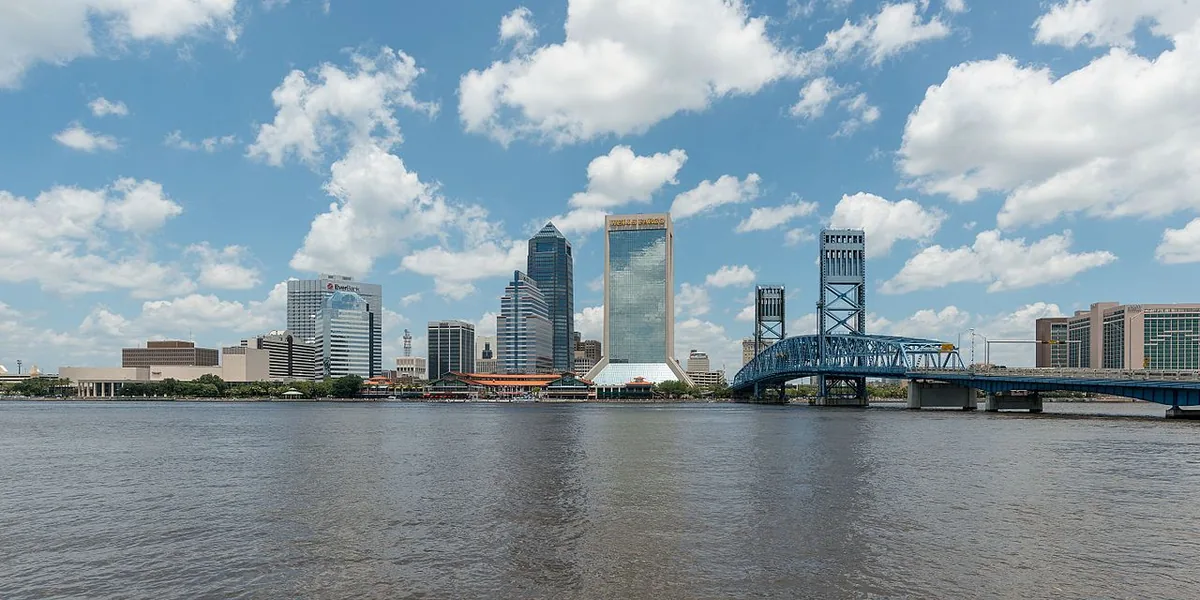 The Jacksonville, Florida skyline across the St. Johns River with the blue Main Street Bridge