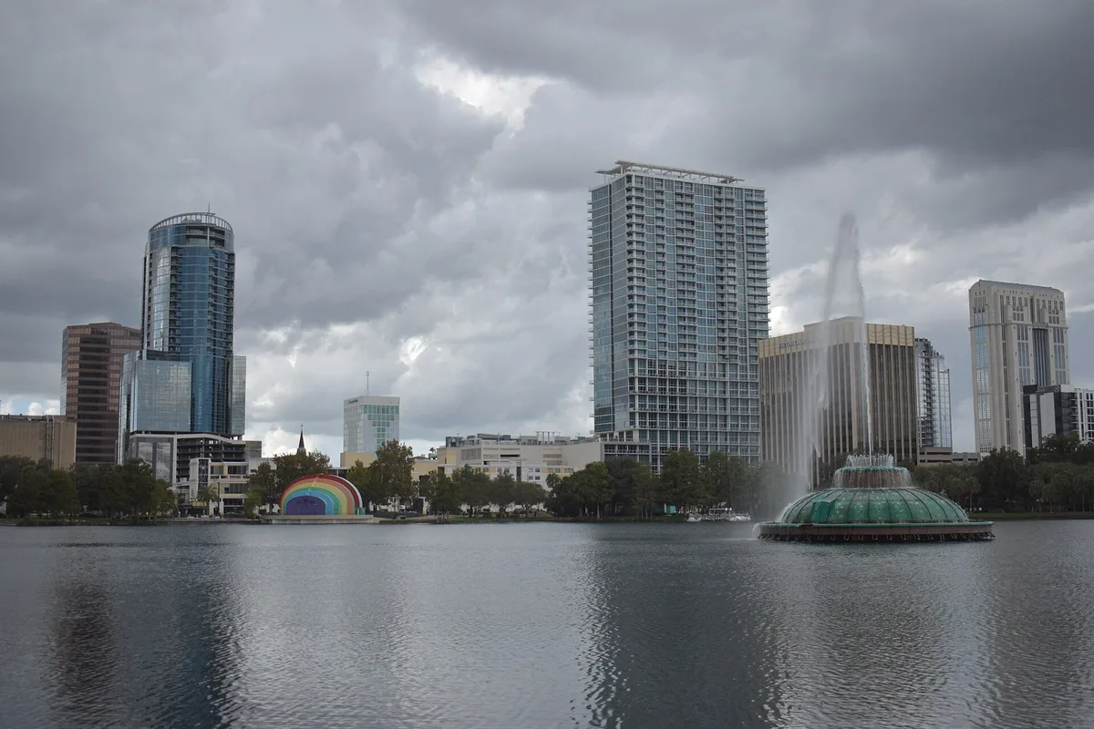 Lake Eola's fountain with the downtown Orlando skyline behind