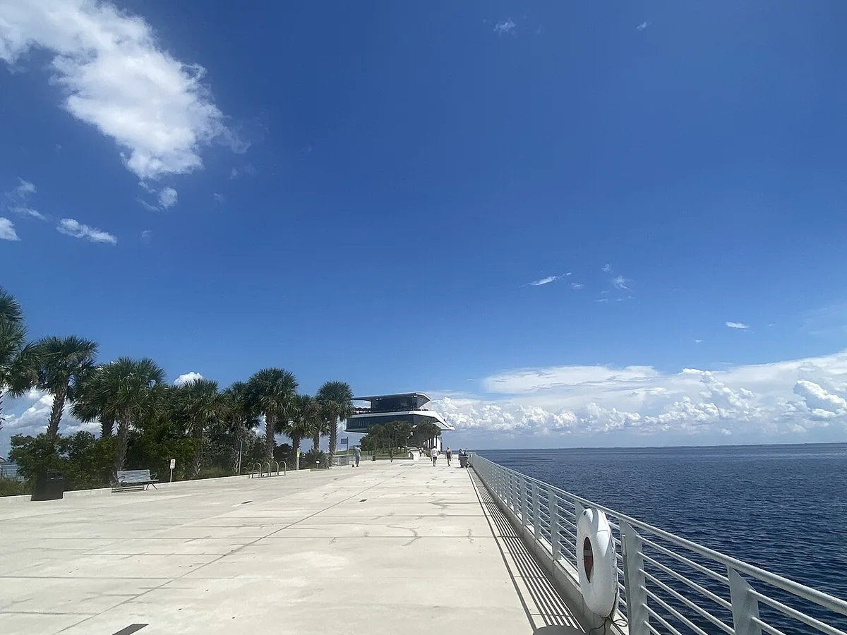 The wide promenade of the St. Pete Pier leading to the Pier Point pavilion over Tampa Bay