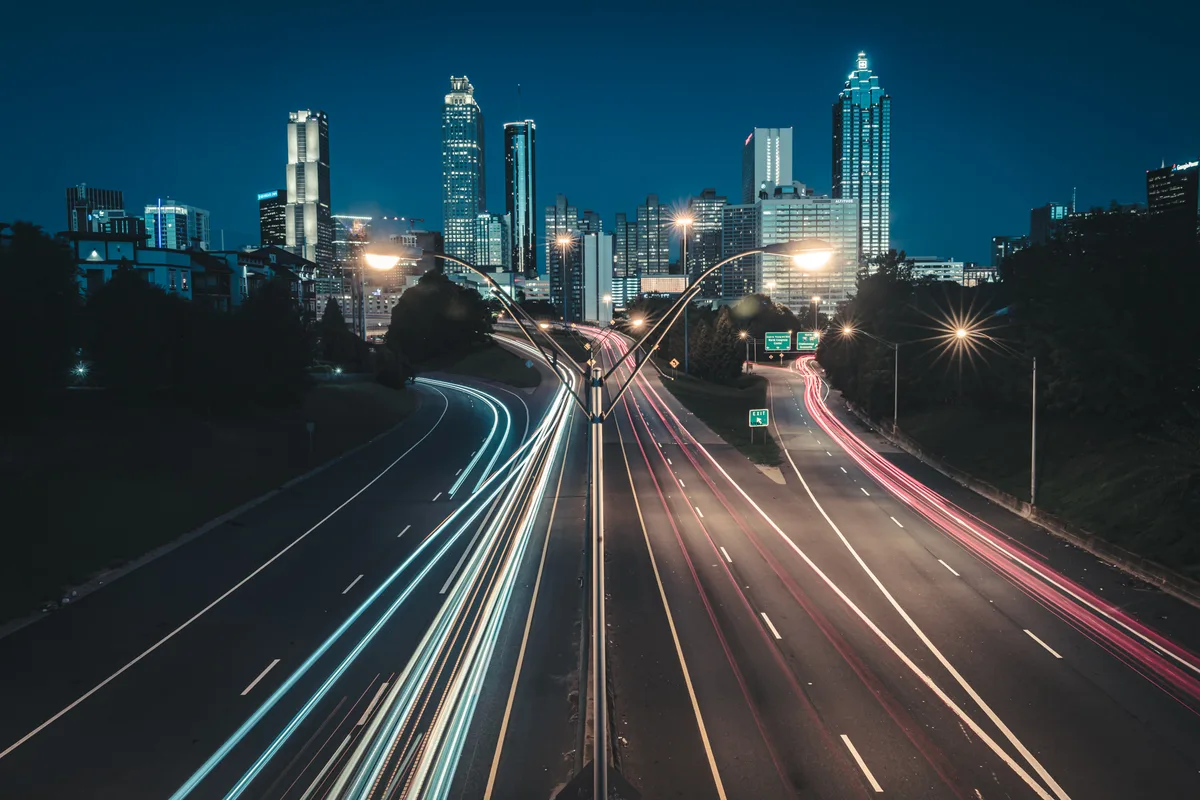The Atlanta, Georgia skyline at dawn with light trails from morning traffic
