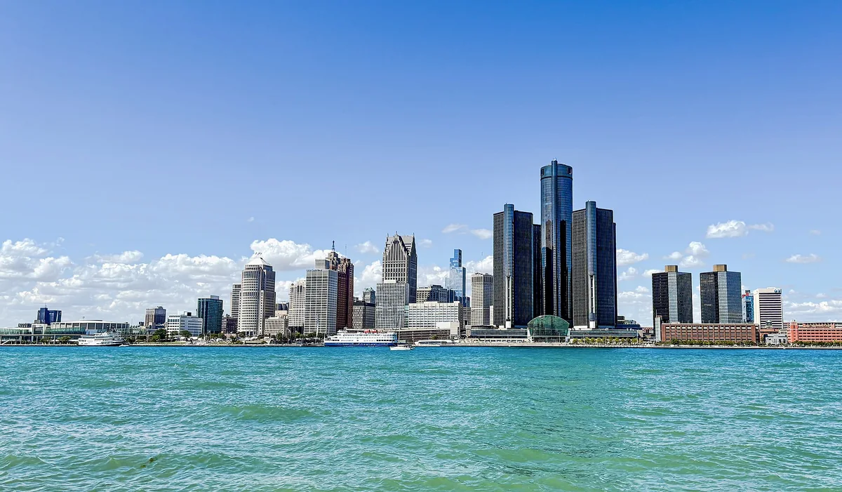 The Detroit skyline across the Detroit River, with the GM Renaissance Center towers at center