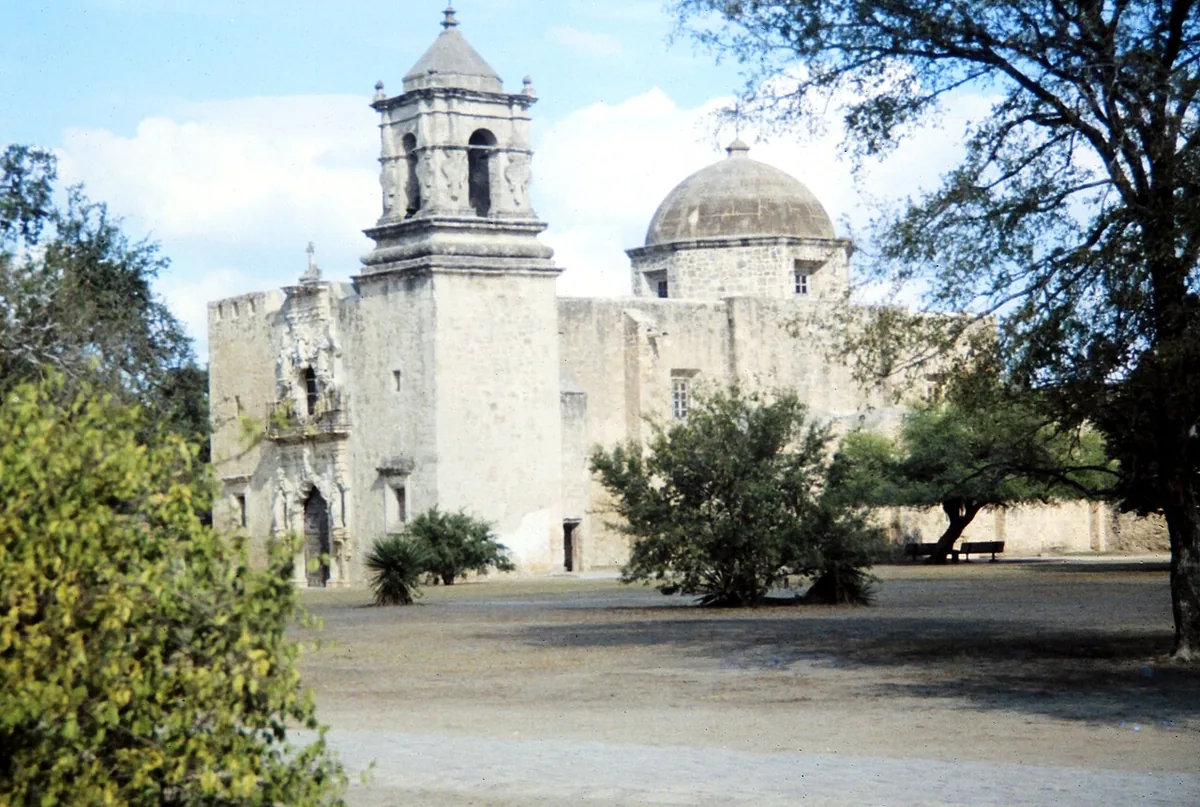 The bell tower and dome of Mission San José in San Antonio