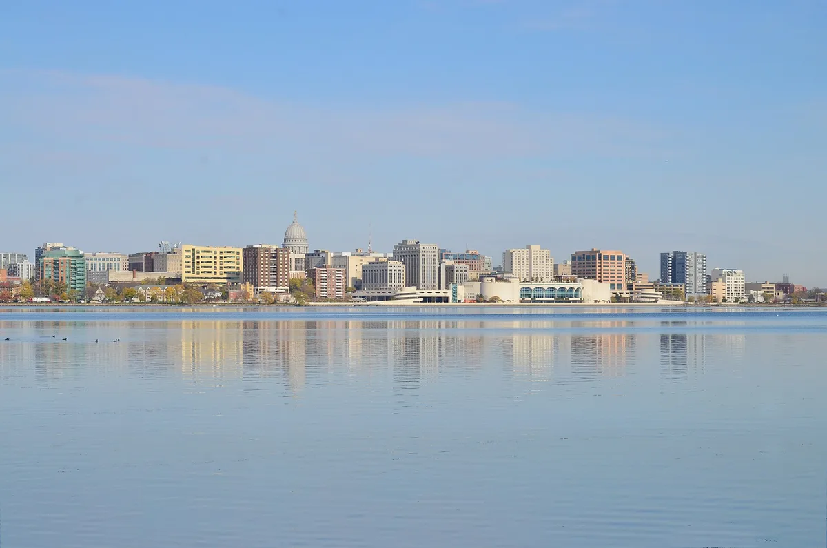 The Madison, Wisconsin skyline seen from Olin Park across Lake Monona