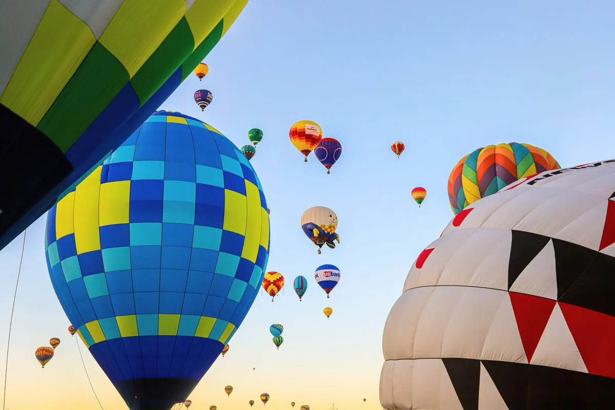 Hot air balloons rising at dawn over Albuquerque, New Mexico