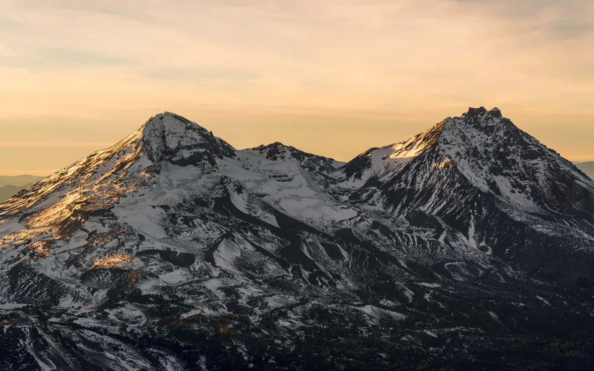Snow-capped Cascade peaks at sunset near Bend, Oregon