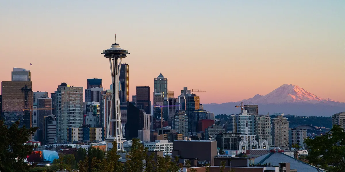 Seattle's skyline from Kerry Park at dusk, with the Space Needle in front and Mount Rainier on the horizon